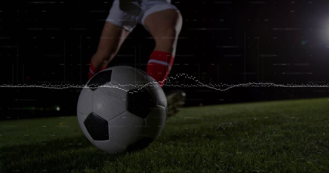 Dynamic Shot of Soccer Ball Kicked Under Stadium Lights