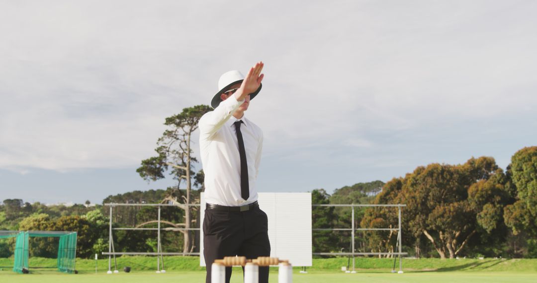 Cricket Umpire Signaling Out on the Field - Free Images, Stock Photos and Pictures on Pikwizard.com