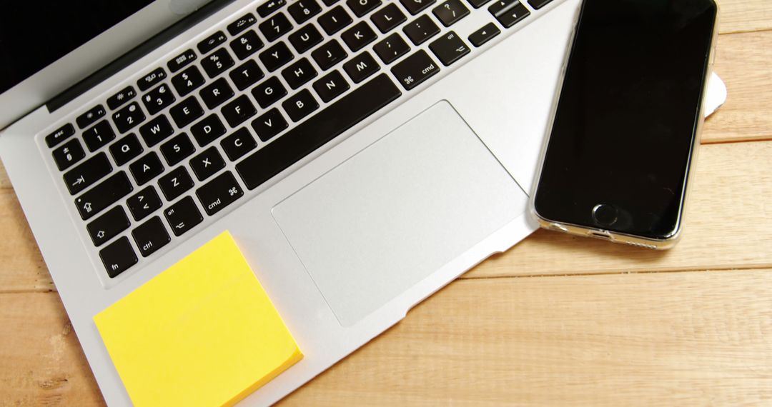 Laptop with Smartphone and Sticky Note on Wooden Desk - Free Images, Stock Photos and Pictures on Pikwizard.com