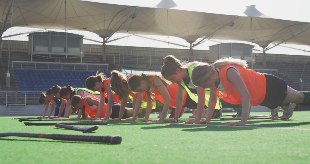 Female Field Hockey Team Doing Push-Ups During Outdoor Training - Free Images, Stock Photos and Pictures on Pikwizard.com