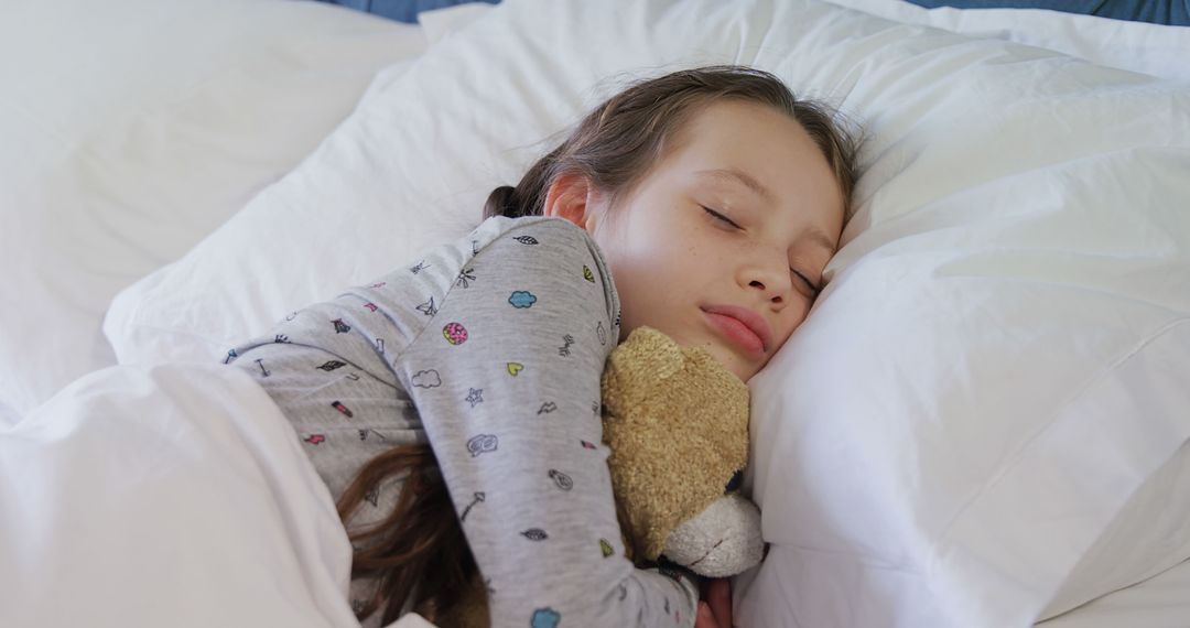 Peaceful Child Sleeping in Bed Hugging Teddy Bear - Free Images, Stock Photos and Pictures on Pikwizard.com