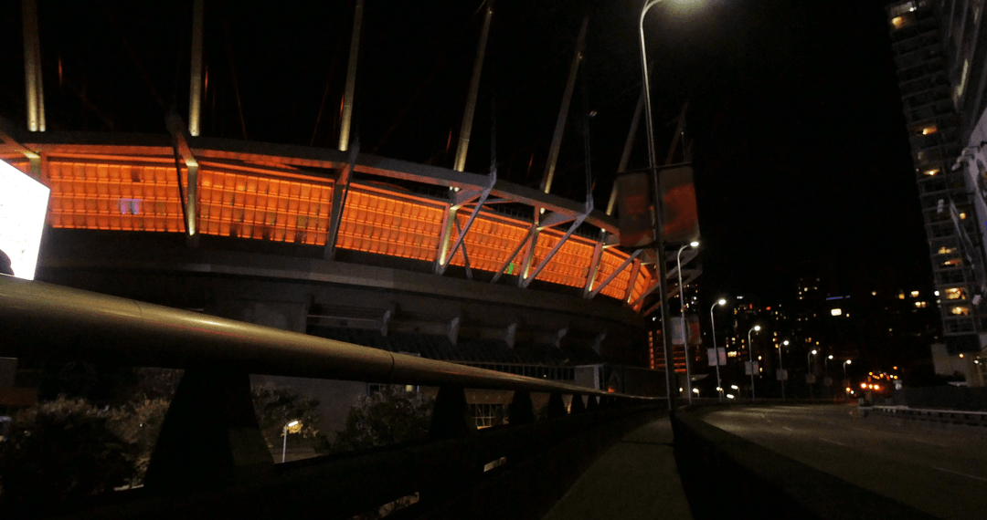 Vibrant Nighttime City Scape with Illuminated Modern Architecture