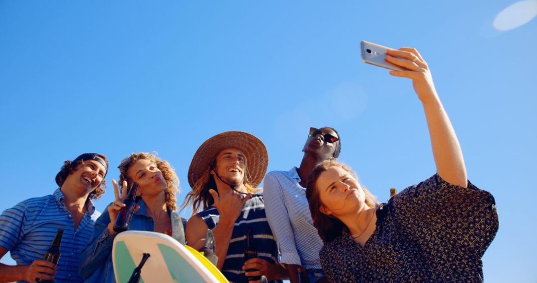 Friends Taking Selfie at Beach under Clear Blue Sky - Free Images, Stock Photos and Pictures on Pikwizard.com