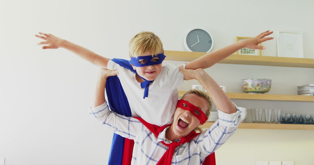 Father and Son Playing Superheroes with Capes and Masks Indoors - Free Images, Stock Photos and Pictures on Pikwizard.com