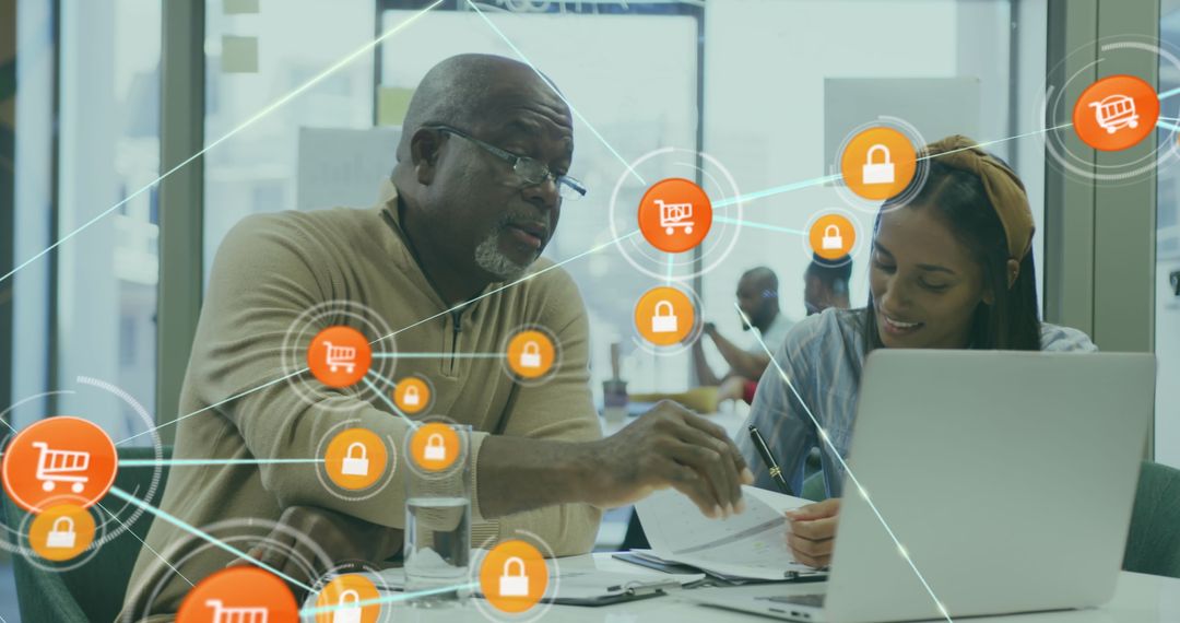 Connected Coworkers Analyzing Reports on Laptop with Digital Icons