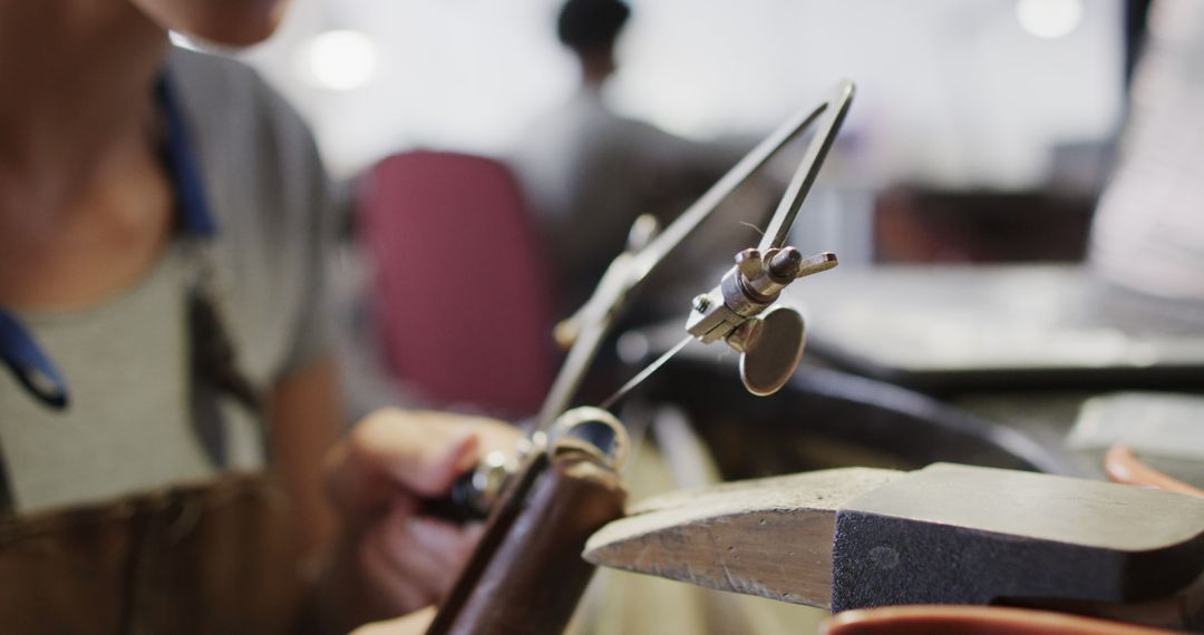 Close-up of Jeweler Crafting with Precision Tools