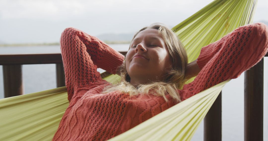 Young Woman Relaxing in Hammock overhead, Waterfront View - Free Images, Stock Photos and Pictures on Pikwizard.com