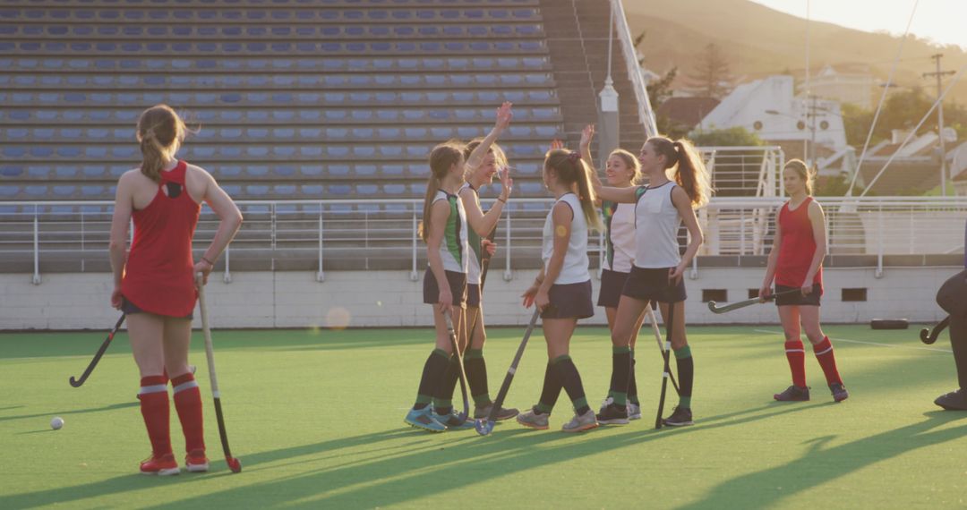 Girls Celebrating After Field Hockey Practice on Sunny Day - Free Images, Stock Photos and Pictures on Pikwizard.com