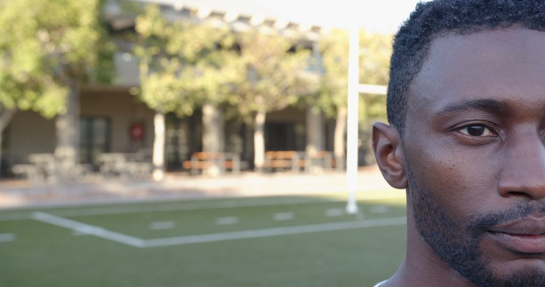 African American Man On Turf Field Highlighting Athletic Focus