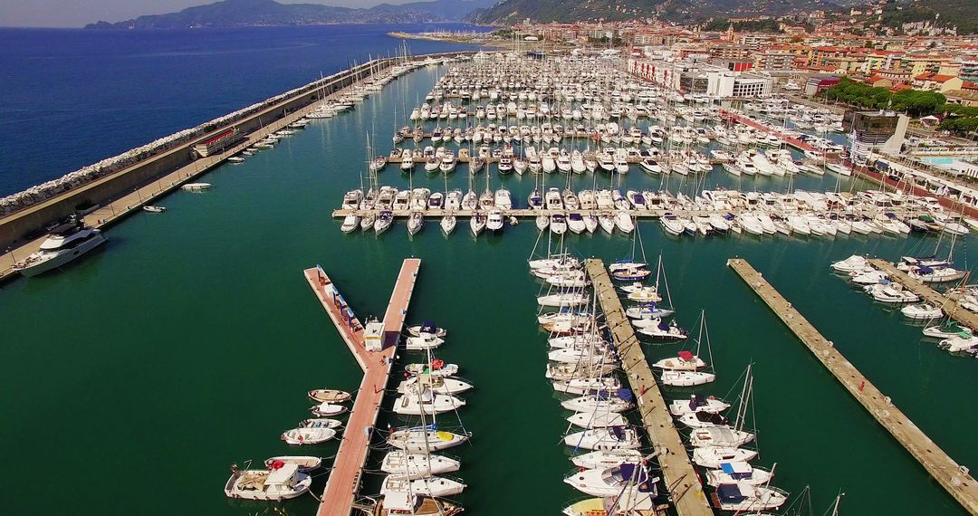 Aerial View of Marina with Numerous Yachts and Boats Docked - Free Images, Stock Photos and Pictures on Pikwizard.com