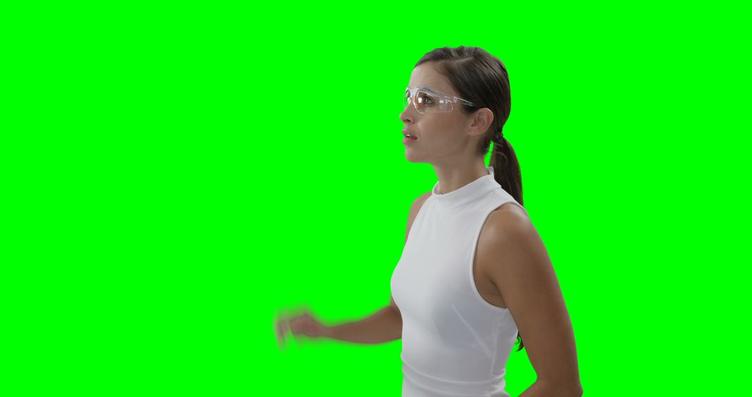 Businesswoman in white blouse pointing, green screen background - Free Images, Stock Photos and Pictures on Pikwizard.com