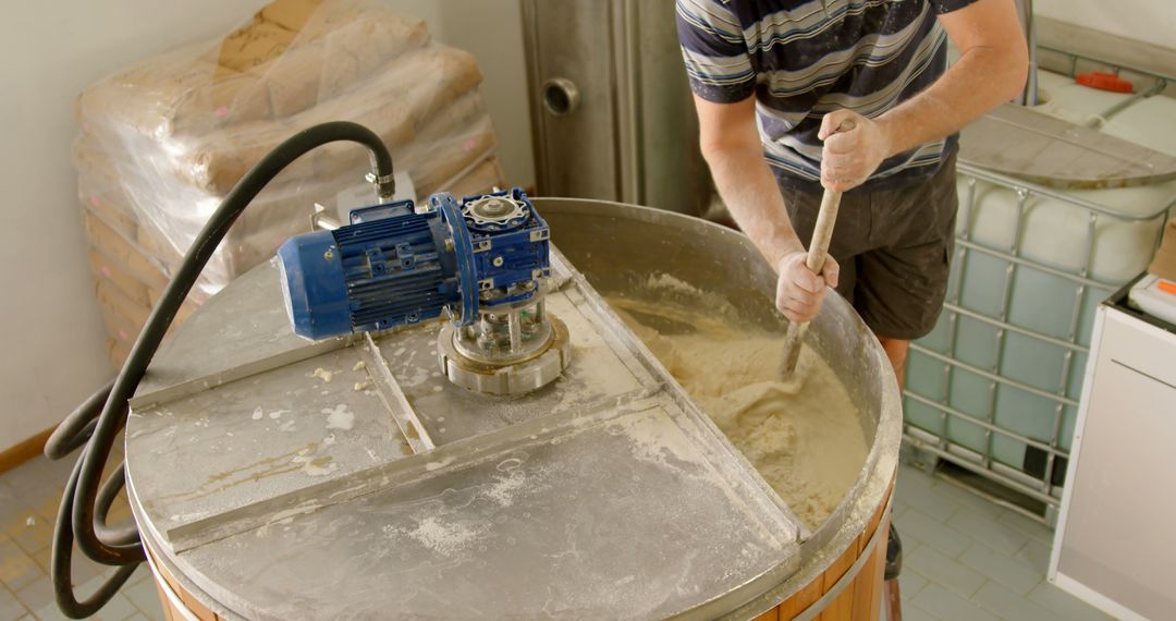 Detail Brewing Process Man Stirring Mash Fermentation Tank - Free Images, Stock Photos and Pictures on Pikwizard.com