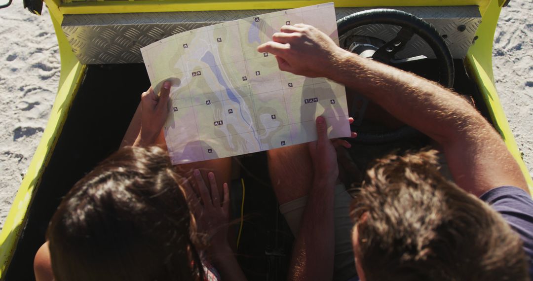 Couple Exploring Beach Destination with Map in Budget-Friendly Road Trip