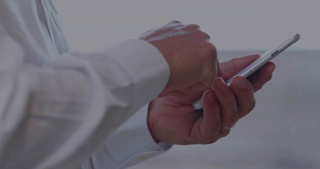 Senior Professional Using Smartphone for Communication