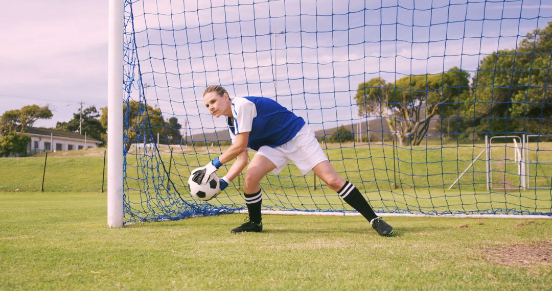 Female Soccer Goalkeeper Blocking Ball On Field - Free Images, Stock Photos and Pictures on Pikwizard.com