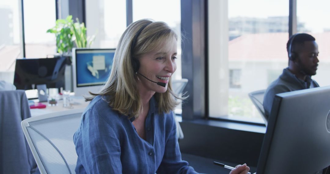 Customer Service Agent Working in Modern Office with Headset