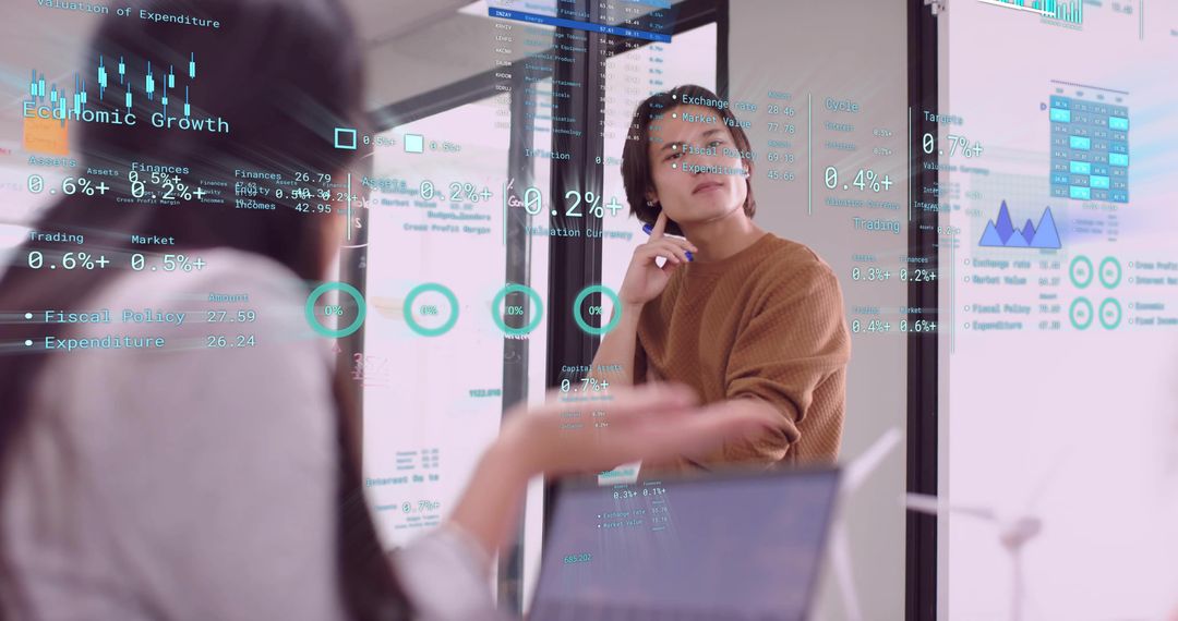 Colleagues Analyzing Financial Metrics with Data Visualization