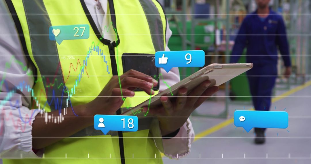 Supervisor Using Tablet for Real-Time Data Analysis at Factory
