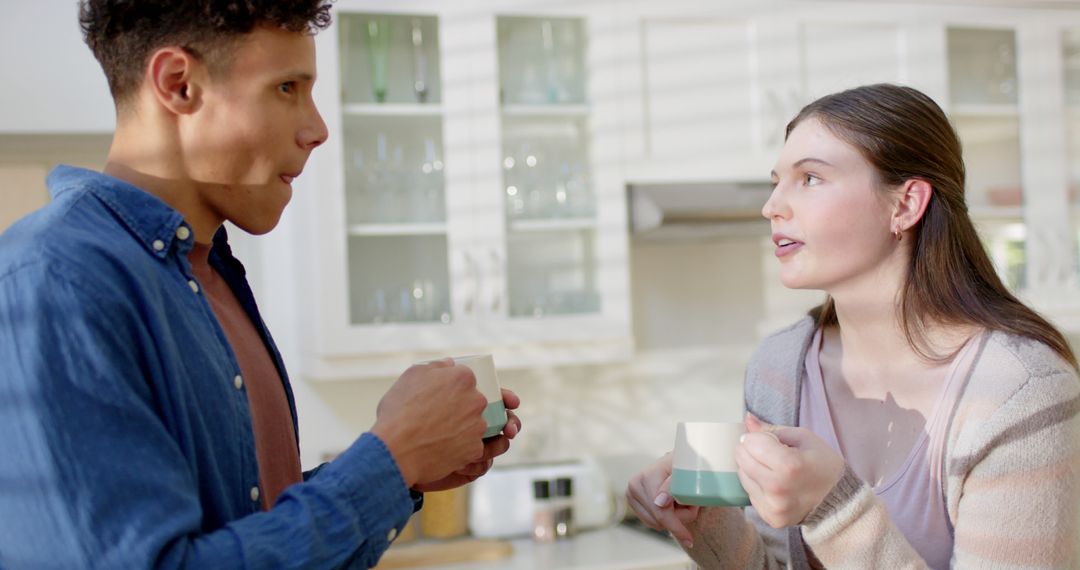 Couple Enjoying Coffee and Conversation in Bright Kitchen