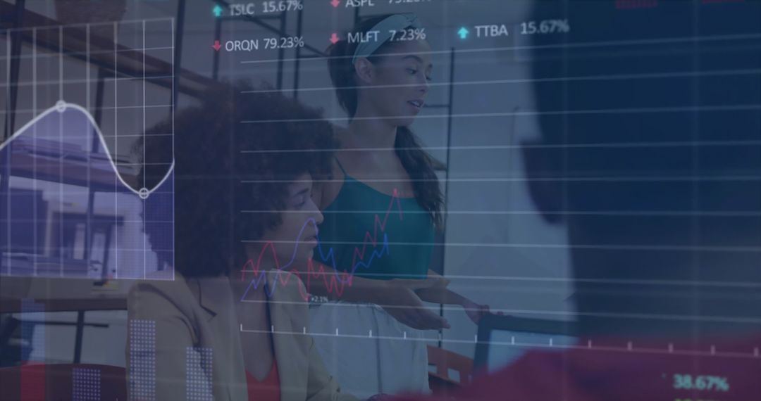 Diverse Colleagues Analyzing Digital Financial Data in Office Meeting