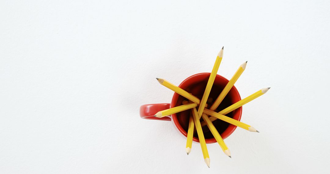 Top View of Pencils in Red Mug on White Background - Free Images, Stock Photos and Pictures on Pikwizard.com