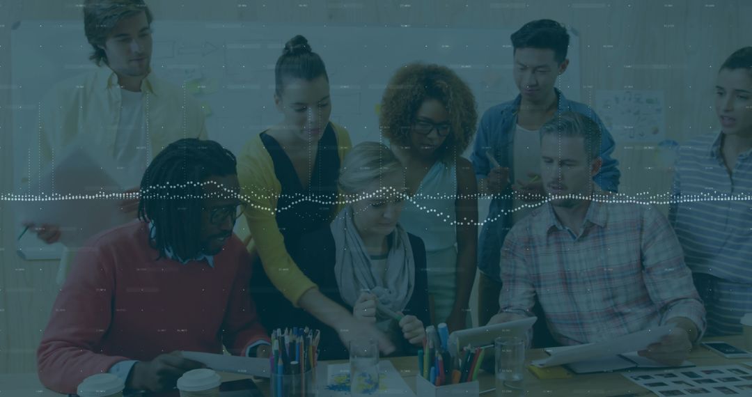 Diverse Group Collaborating on Innovation at Modern Office Table