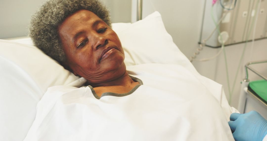 Elderly Woman Resting in Hospital Bed Receiving Medical Care - Free Images, Stock Photos and Pictures on Pikwizard.com