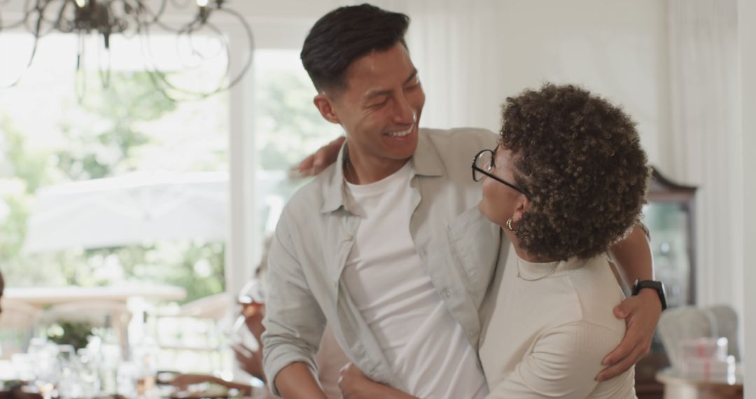 Joyful Couple Enjoying Time Together Setting Dining Table
