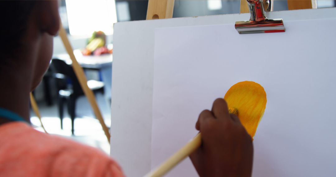 Close-up of artist painting yellow object on canvas - Free Images, Stock Photos and Pictures on Pikwizard.com