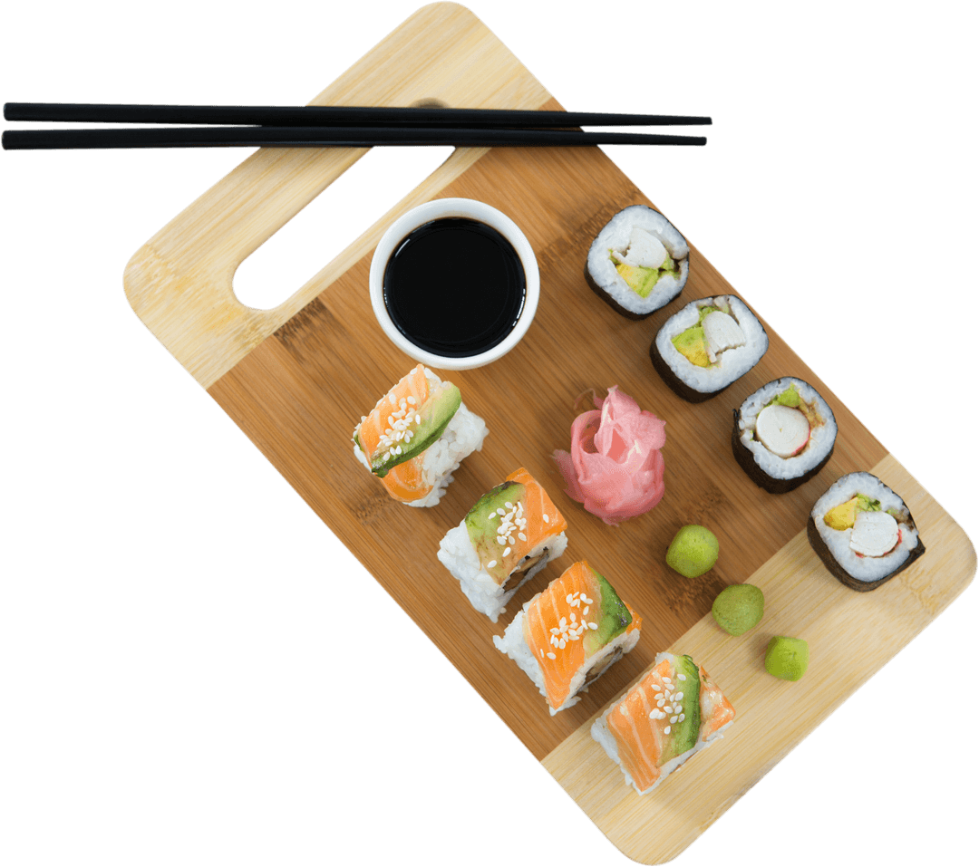 Assorted Sushi with Herbs on Transparent Cutting Board
