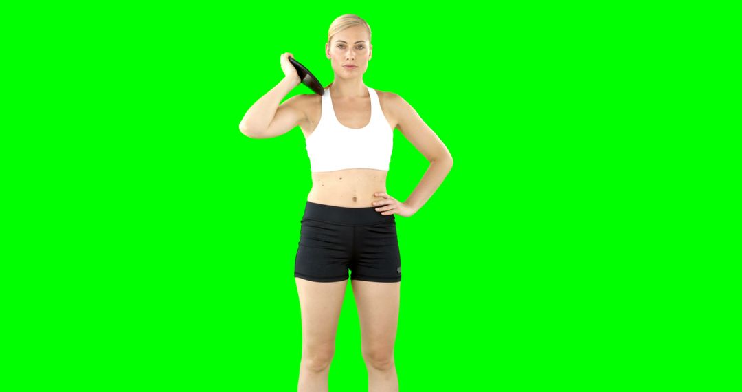 Fit Woman Exercising with Weight Plate on Green Screen - Free Images, Stock Photos and Pictures on Pikwizard.com