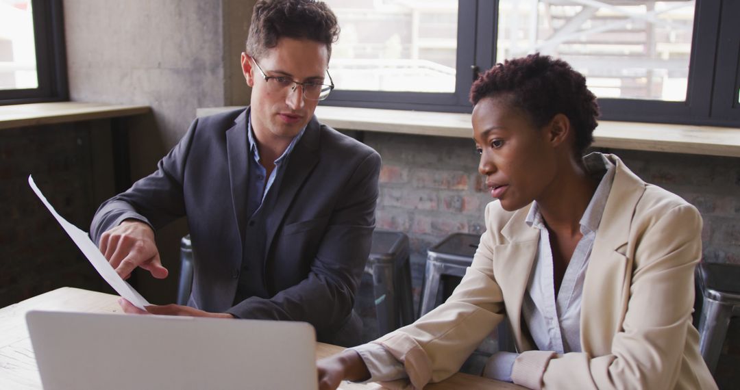 Business Colleagues Discussing Work Strategies at Cafe