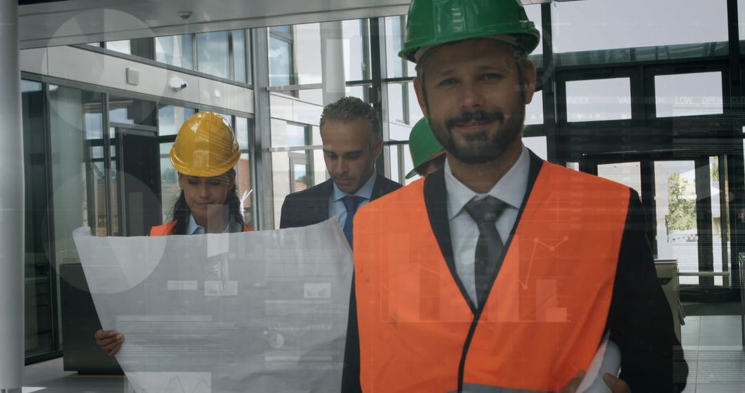 Confident Architects Analyzing Blueprints in Modern Office Setting