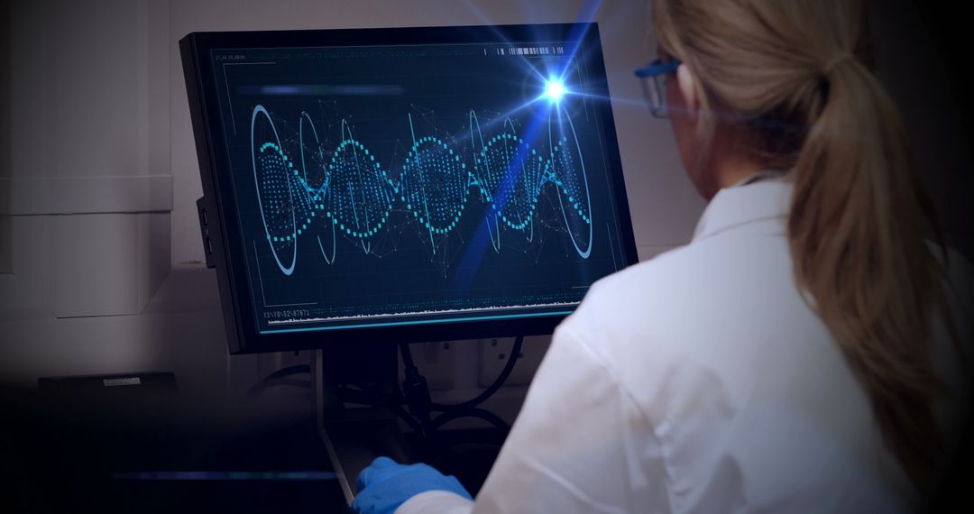 Scientist Analyzing Complex Data Sequences on Computer Monitor