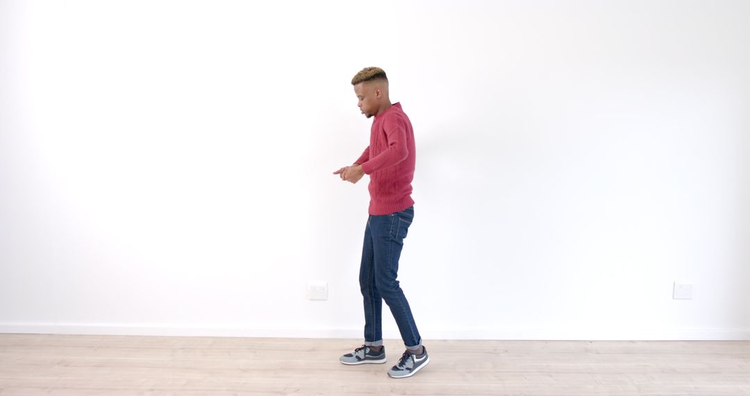 Energetic Man Dancing in Minimalist Room