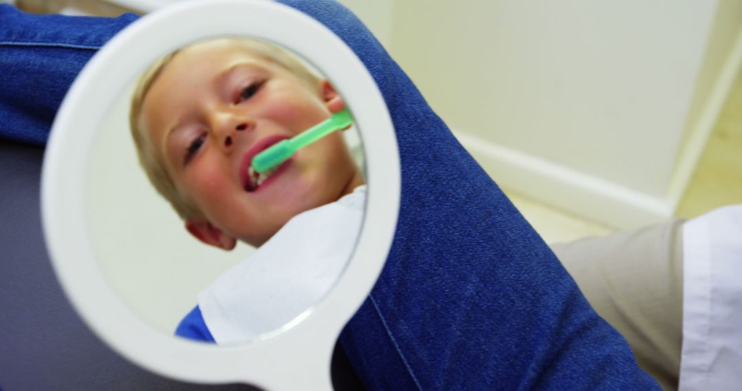 Child having dental checkup with mirror dentist reflection - Free Images, Stock Photos and Pictures on Pikwizard.com