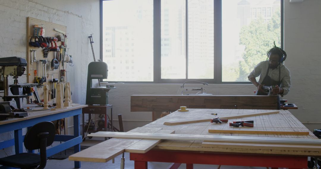 Craftsman Working in Sunlit Carpentry Studio