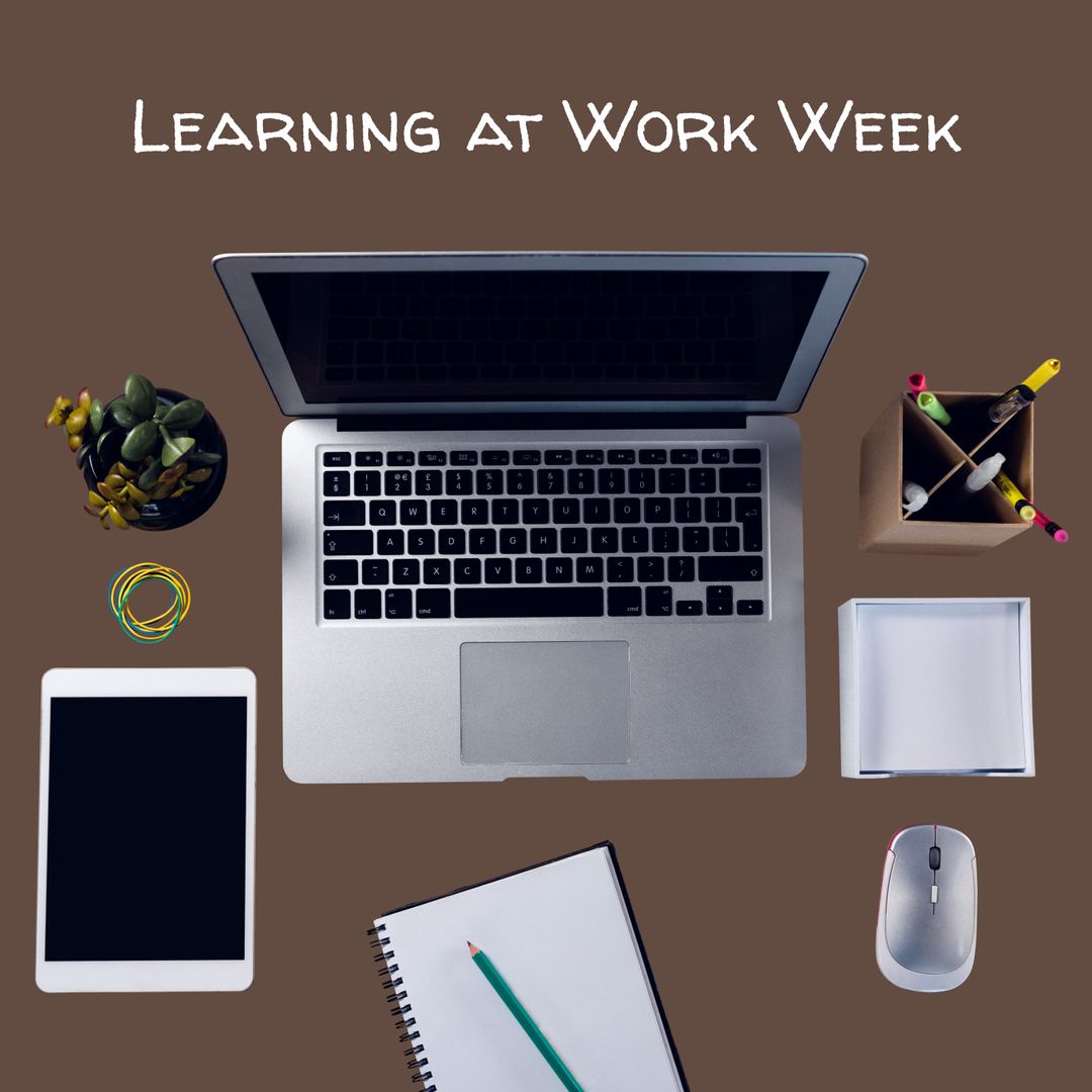 Workplace Learning Concept with Laptop and Office Supplies