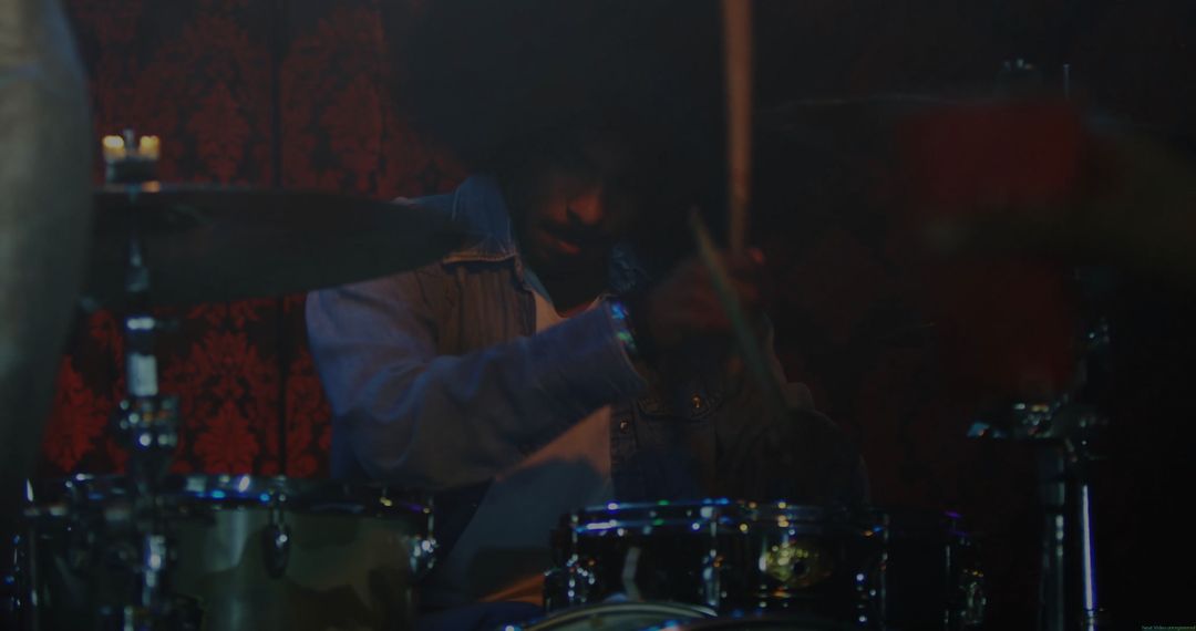 Dynamic Drummer Performing Energetic Rhythm on Stage