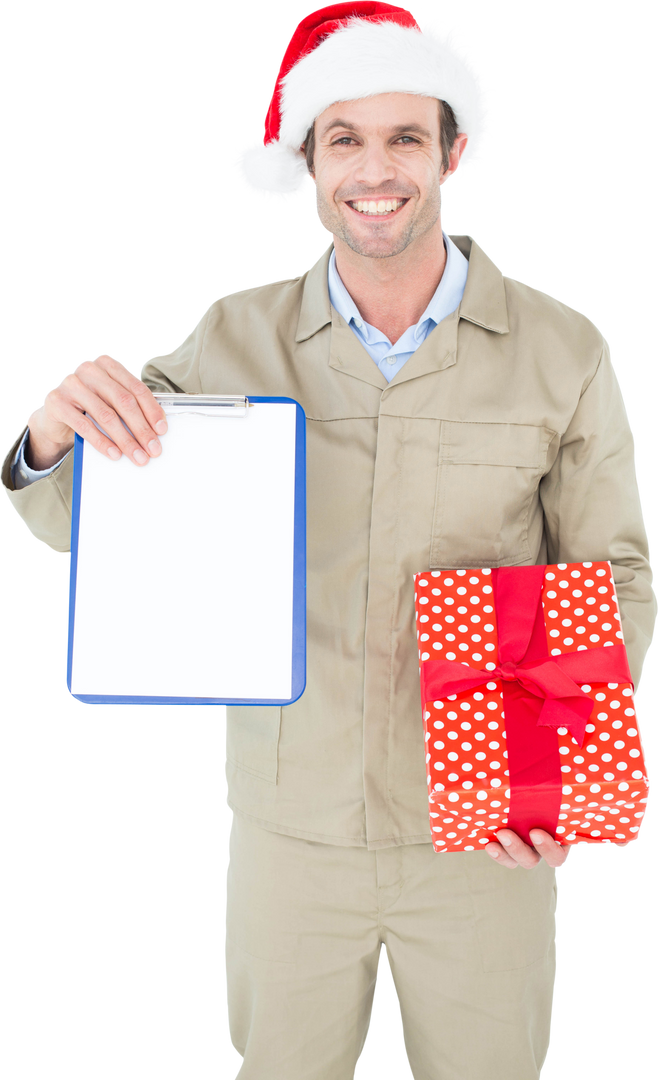 Smiling delivery man in Santa hat holding gift and displaying transparent clipboard - Download Free Stock Images Pikwizard.com