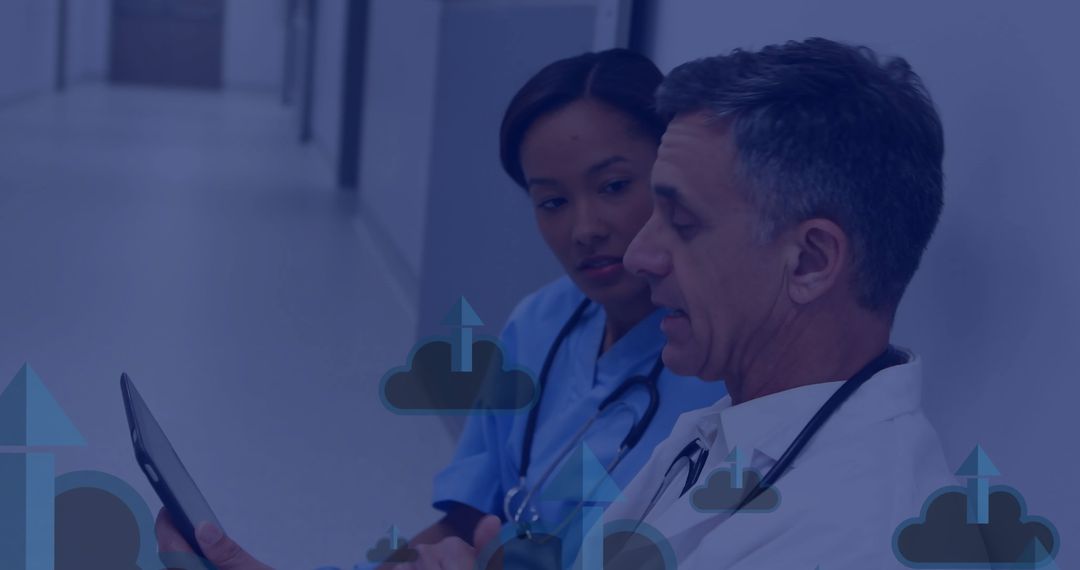 Doctors Discussing Medical Data on Digital Tablet in Hospital