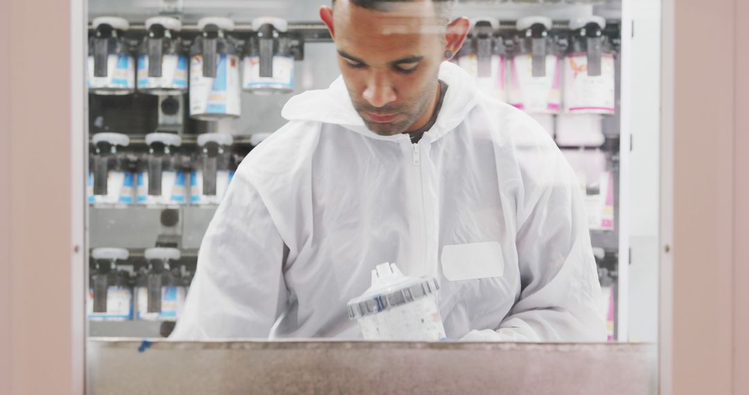 Industrial Worker Mixing Chemicals in Protective Clothing - Free Images, Stock Photos and Pictures on Pikwizard.com