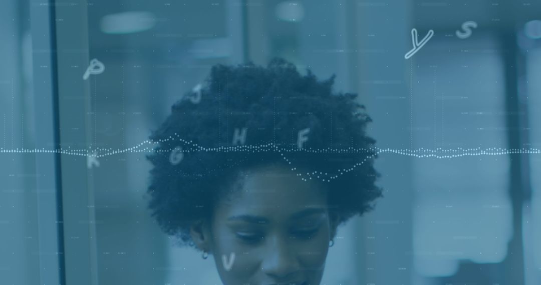 Focused Intern Analyzing Data in Modern Office Environment