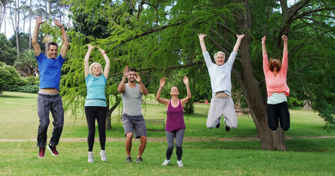 Group of Mature Adults Jumping in Park During Fitness Session - Free Images, Stock Photos and Pictures on Pikwizard.com