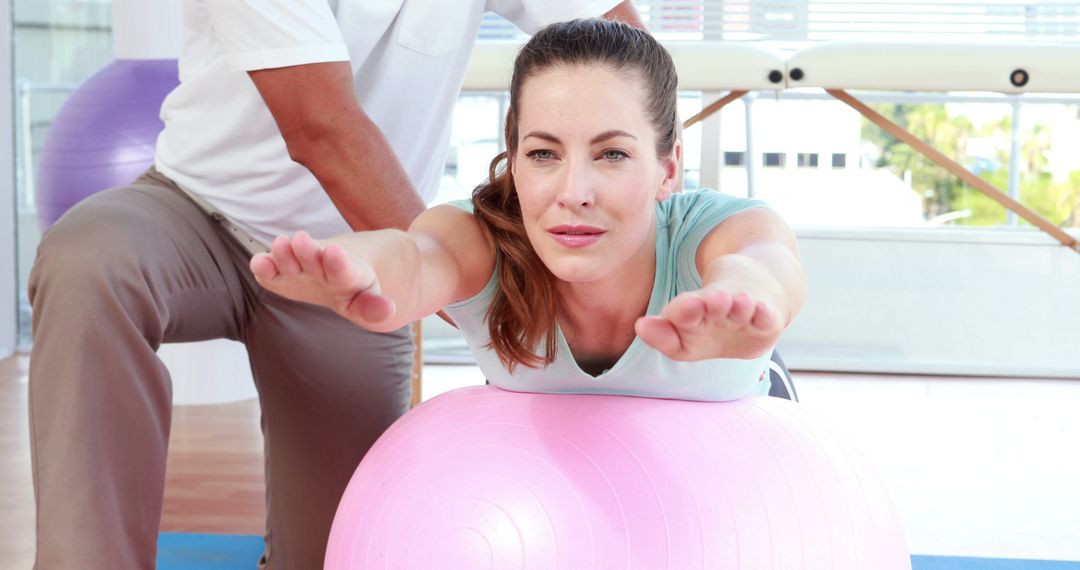 Young Woman in Physiotherapy Session with Exercise Ball - Free Images, Stock Photos and Pictures on Pikwizard.com