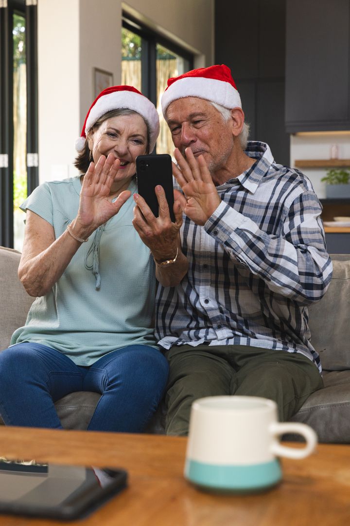 Senior Couple Video Calling during Christmas Celebration at Home