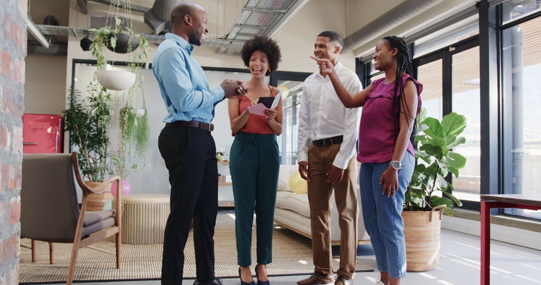 Diverse Team Discussing Business Project in Modern Office Setting