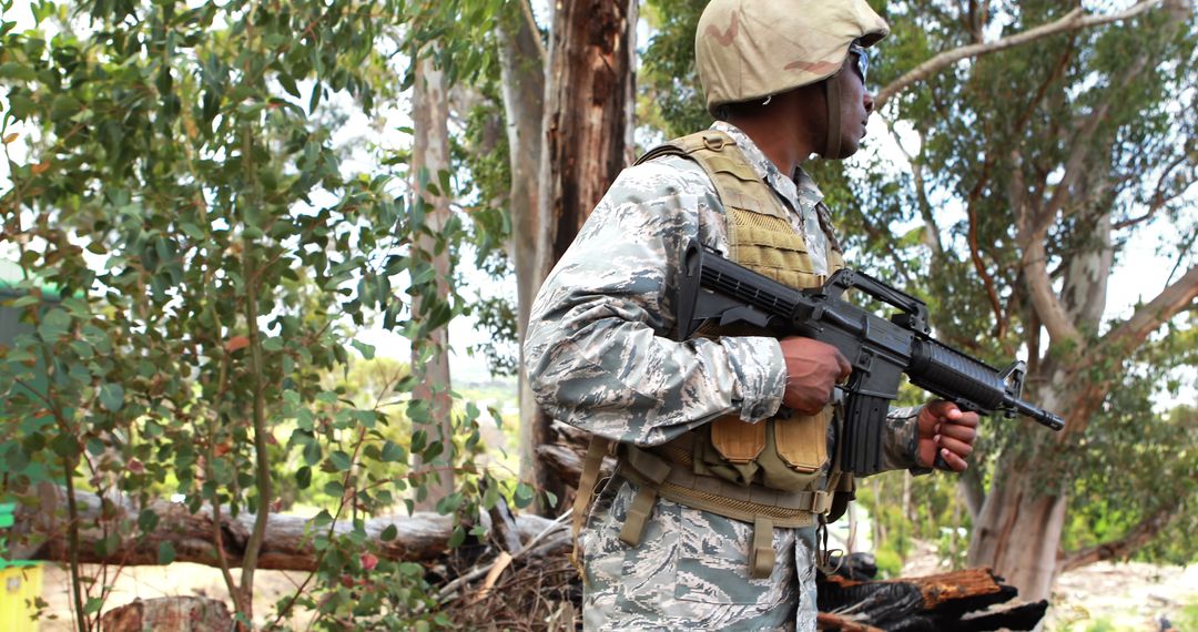 Vigilant Soldier Standing Alert in Woodland Area