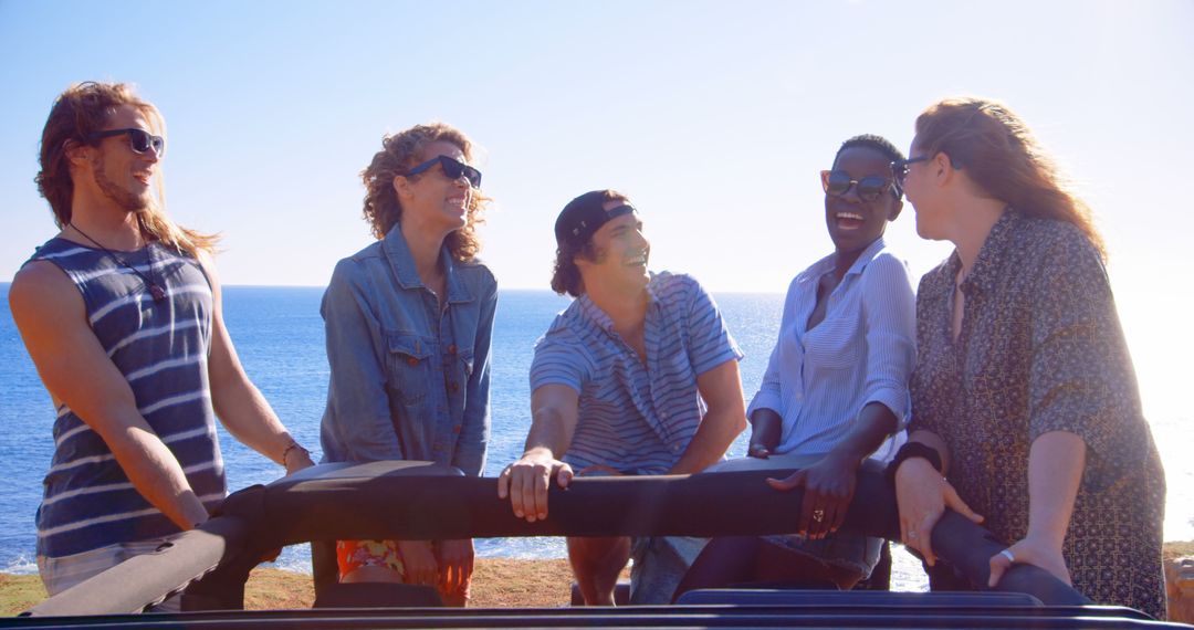 Friends Enjoying Scenic Coastal View on a Sunny Day - Free Images, Stock Photos and Pictures on Pikwizard.com