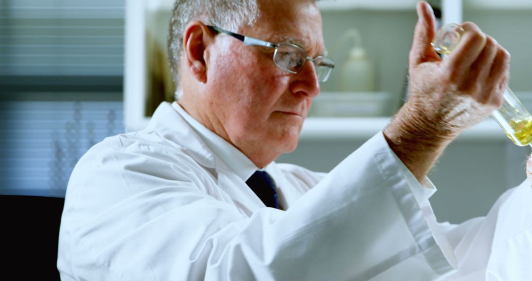 Senior Scientist Conducting Laboratory Research with Test Tube - Free Images, Stock Photos and Pictures on Pikwizard.com